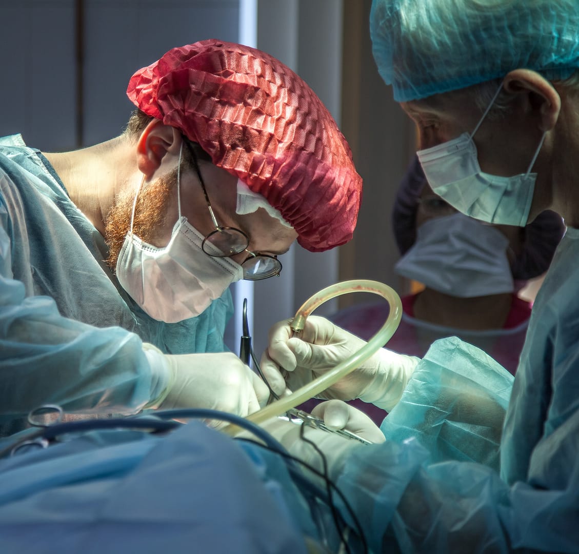 two surgeons performing a surgery
