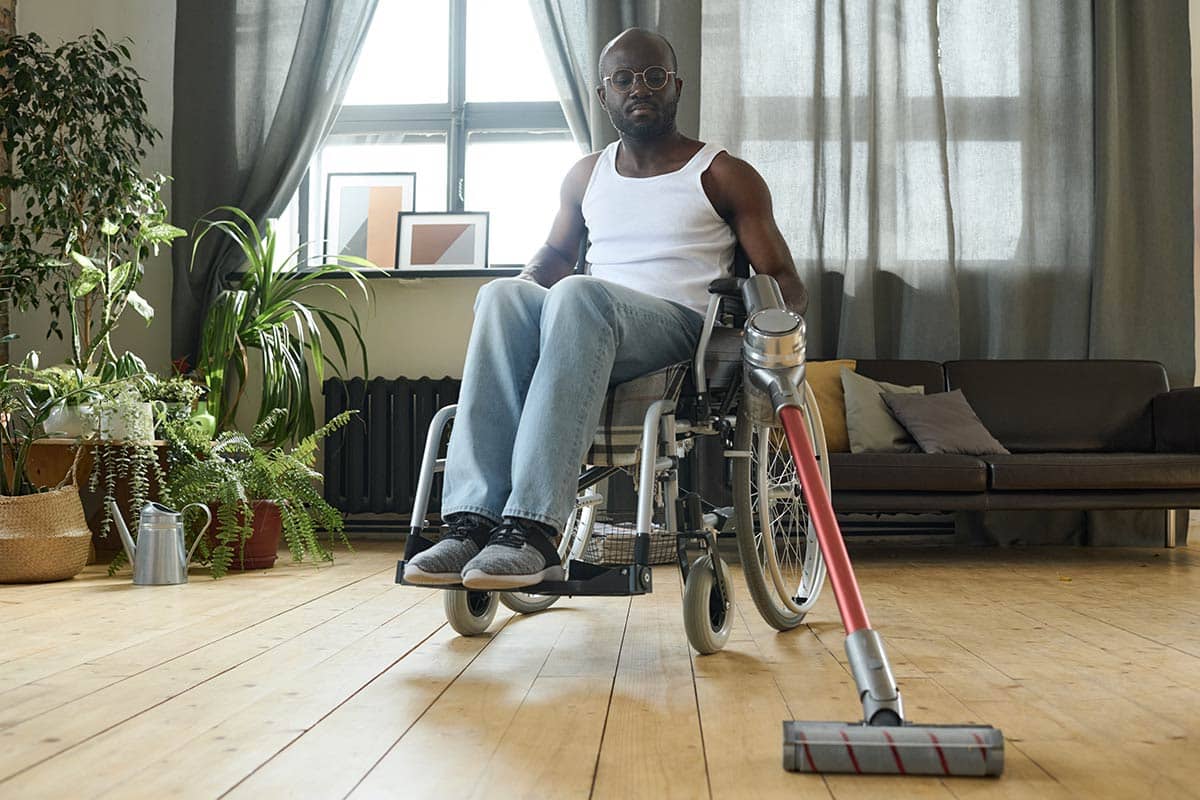 disabled man doing housework at home