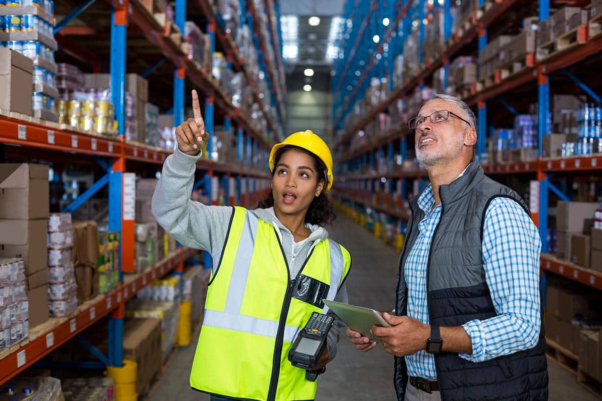 manager and worker in warehouse