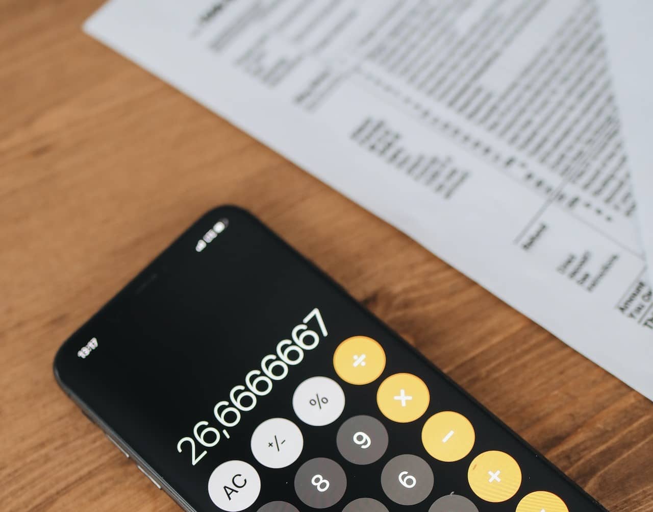 A phone calculator next to forms