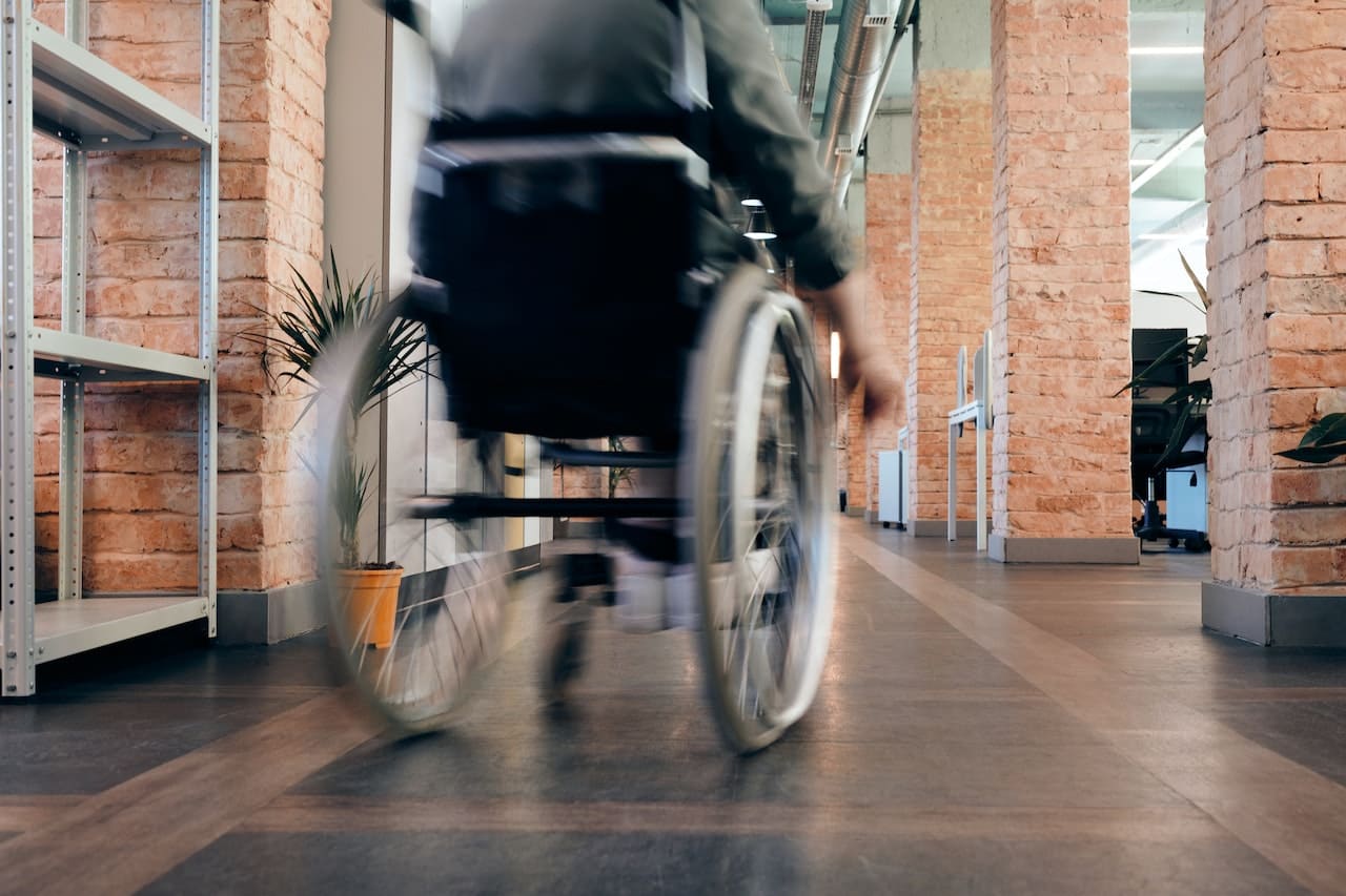 Someone turning a corner in a wheelchair