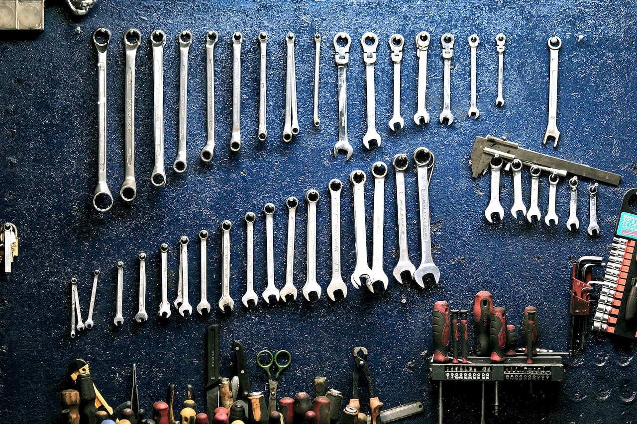 A collection of wrenches on a wall