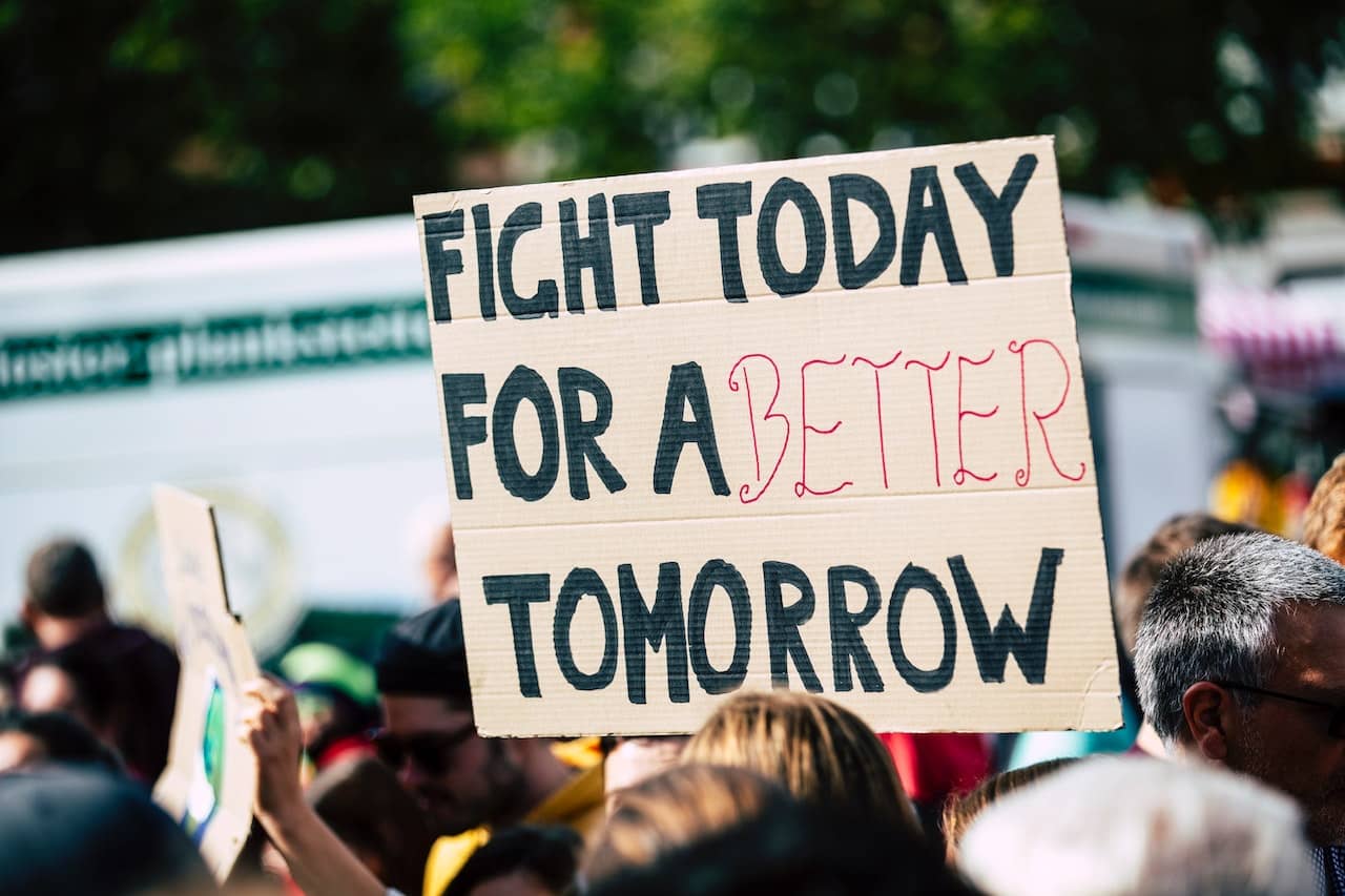 Protest sign stating 'fight today for a better tomorrow'