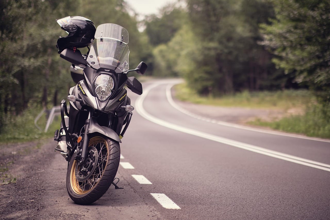 A motorbike parked on the side of a road