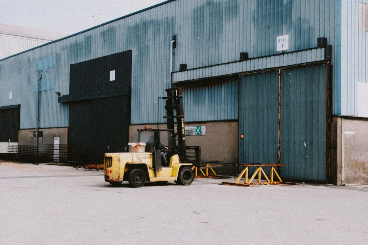 A forklift outside a warehouse