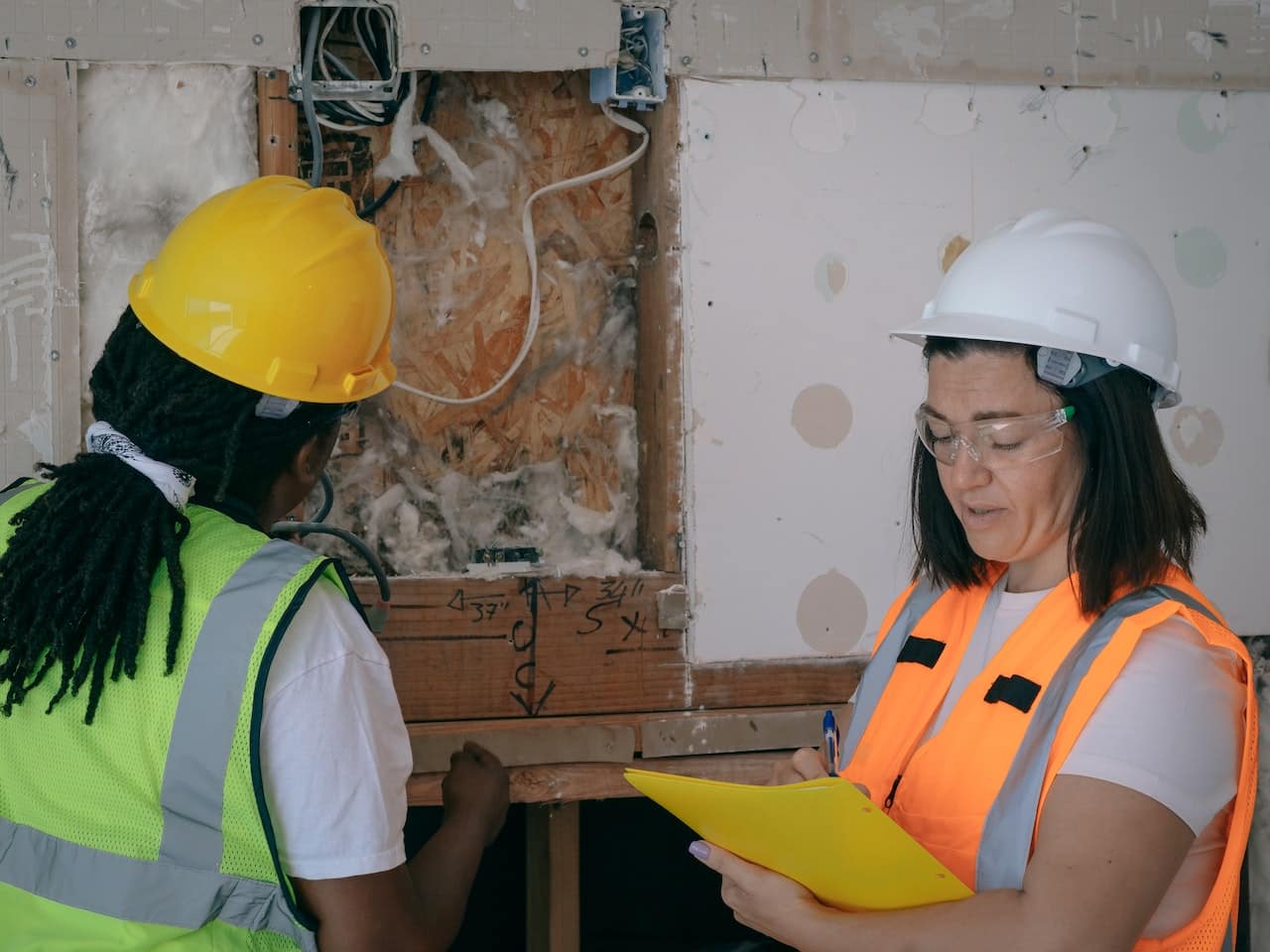 Two people carrying out an inspection in a building