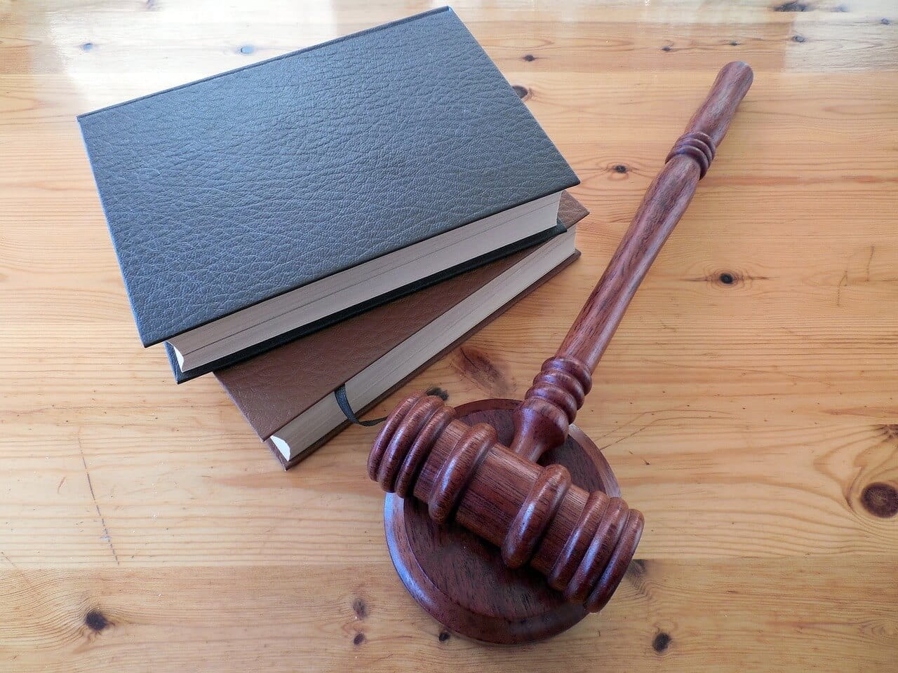 A gavel next to law books