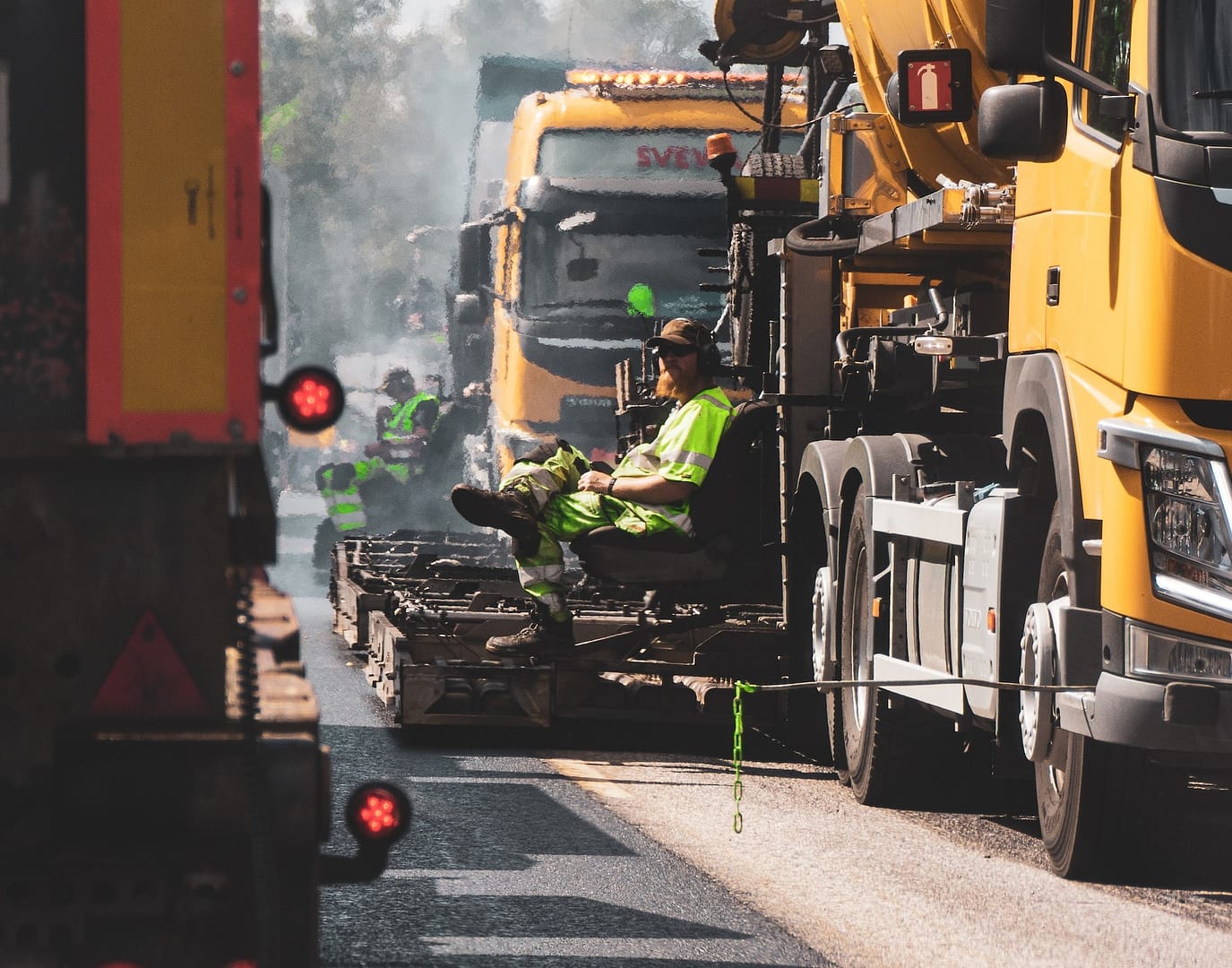 A road worker sitting down in the sun