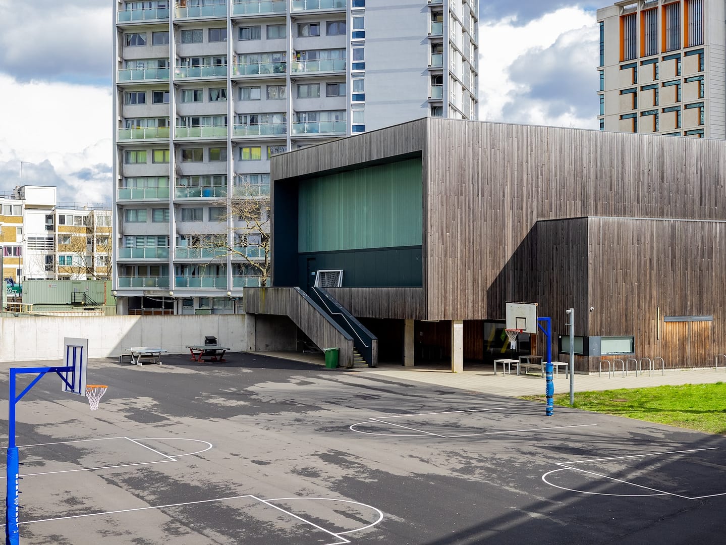 A housing complex surrounding a basketball court