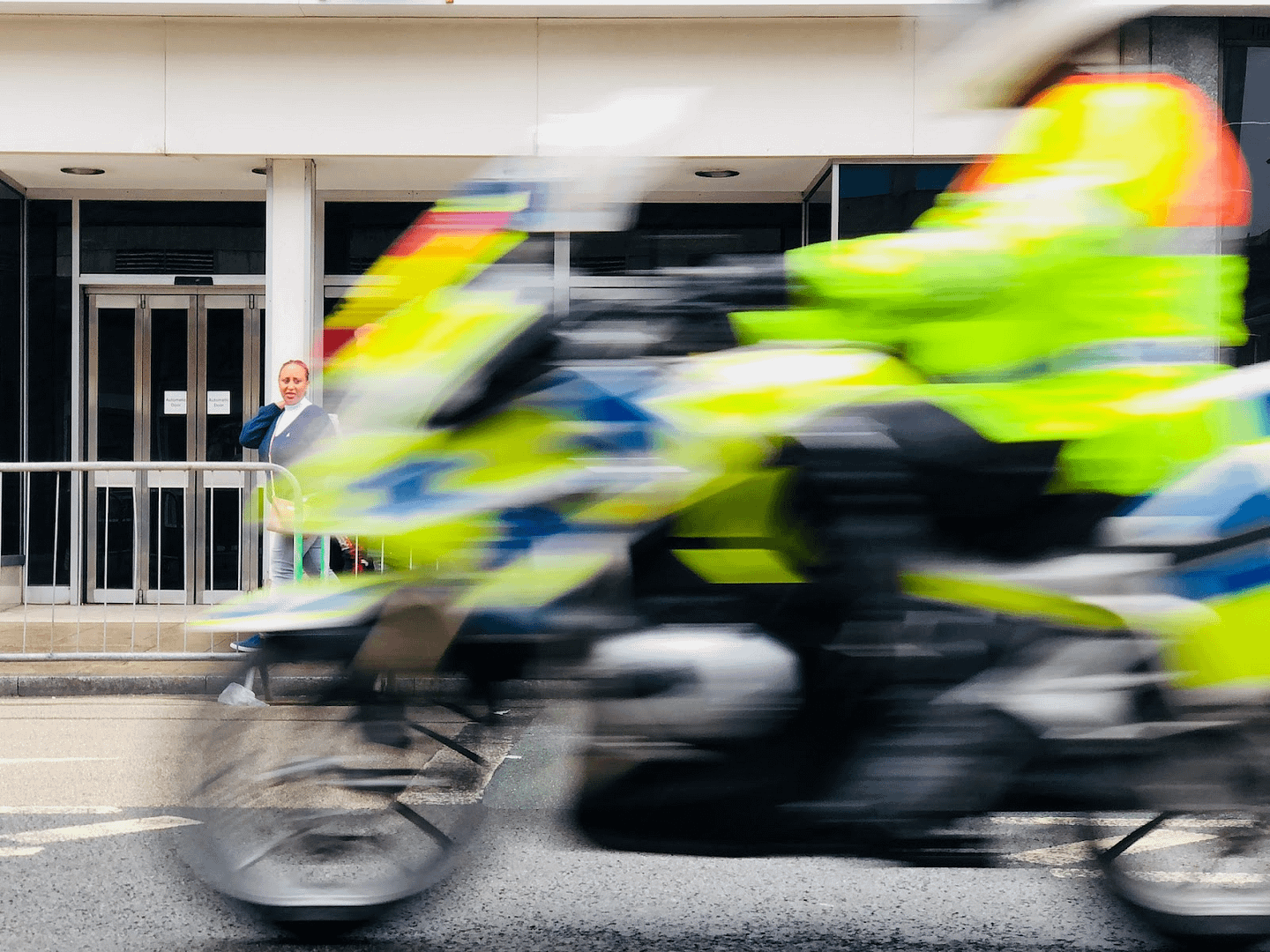 A blurred image of police on a motorbike
