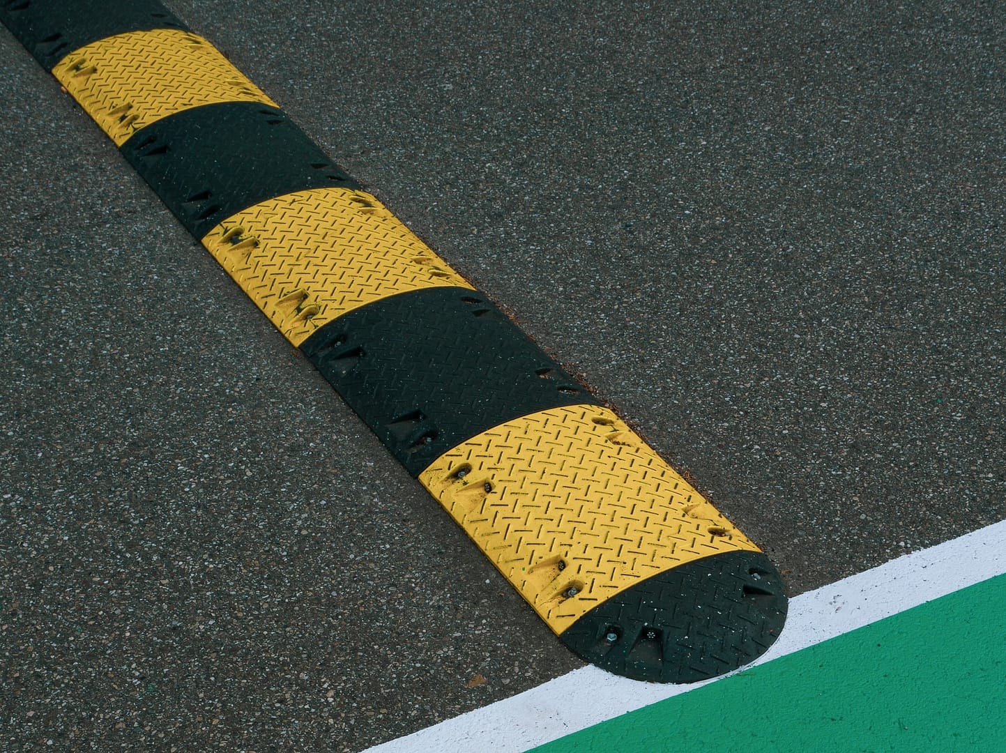 a yellow and black speed bump