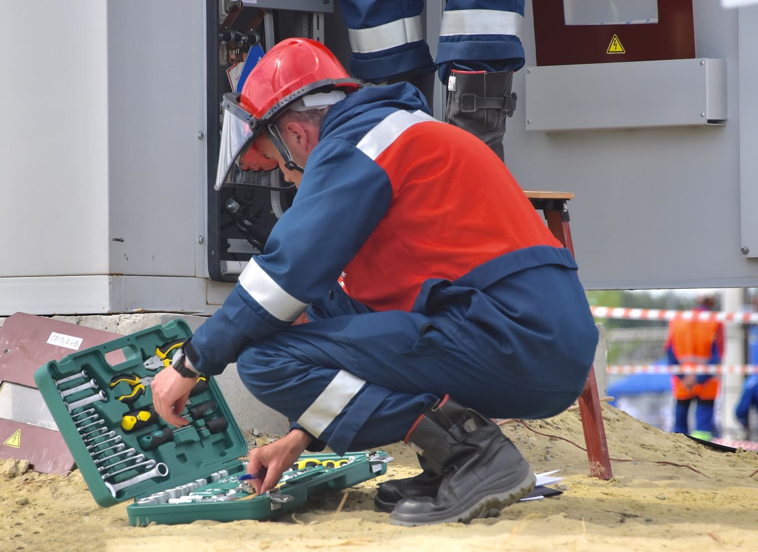 An electrician looking at their tools