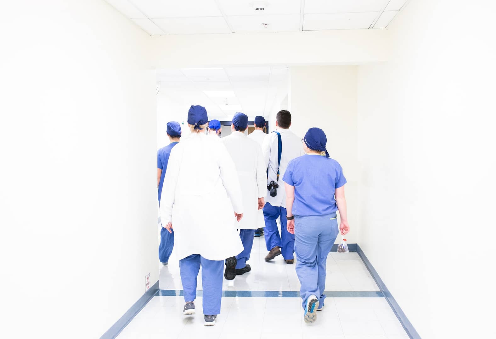 Hospital workers walking down a hallway