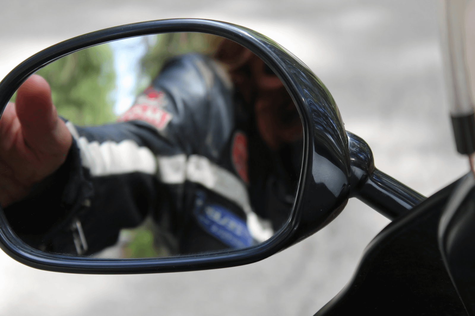 close up view of a rear view mirror on a motorbike