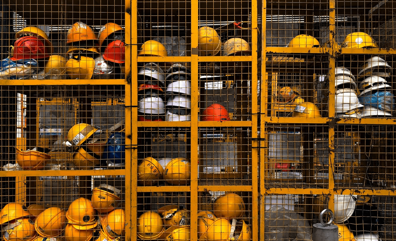 Hard hats in a cage