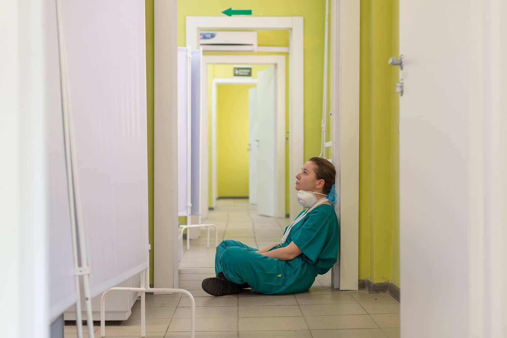 A nurse sat on the floor of a hospital