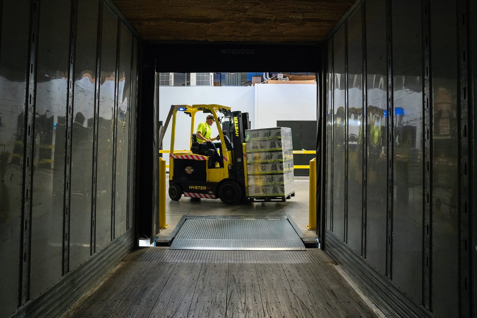 A forklift pictured through a tunnel