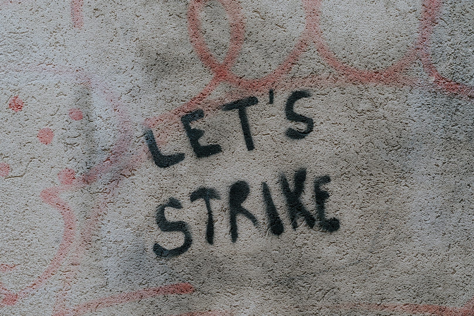 graffiti saying "lets strike"