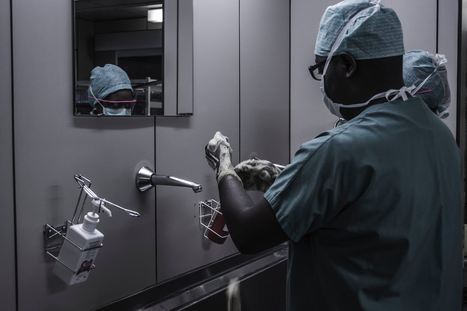 two surgeons washing their hands