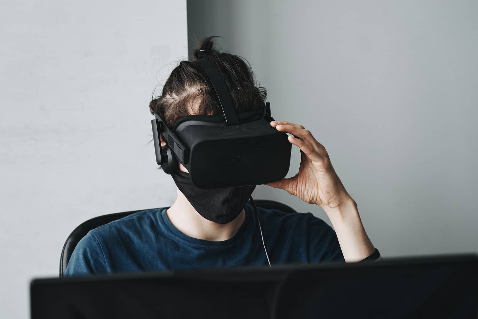 Someone wearing a VR headset