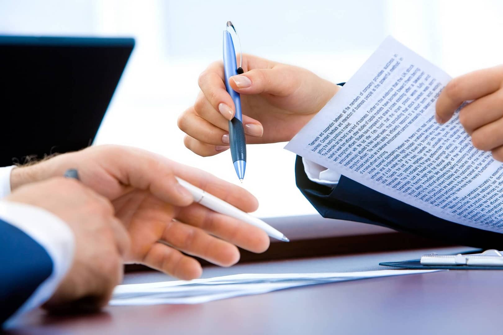 Two people filling out paperwork