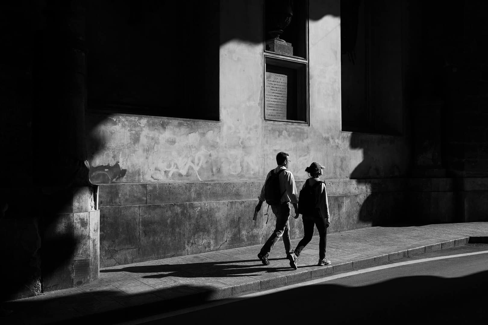 two people walking down a path