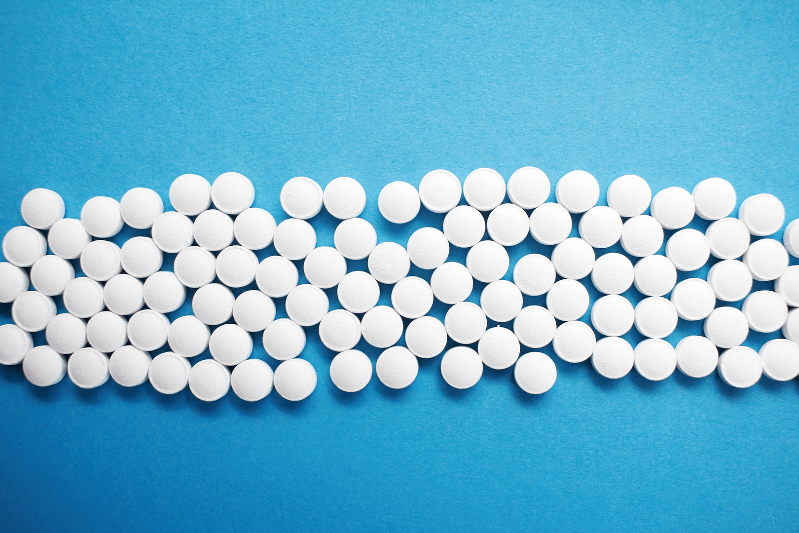 pills against a blue background