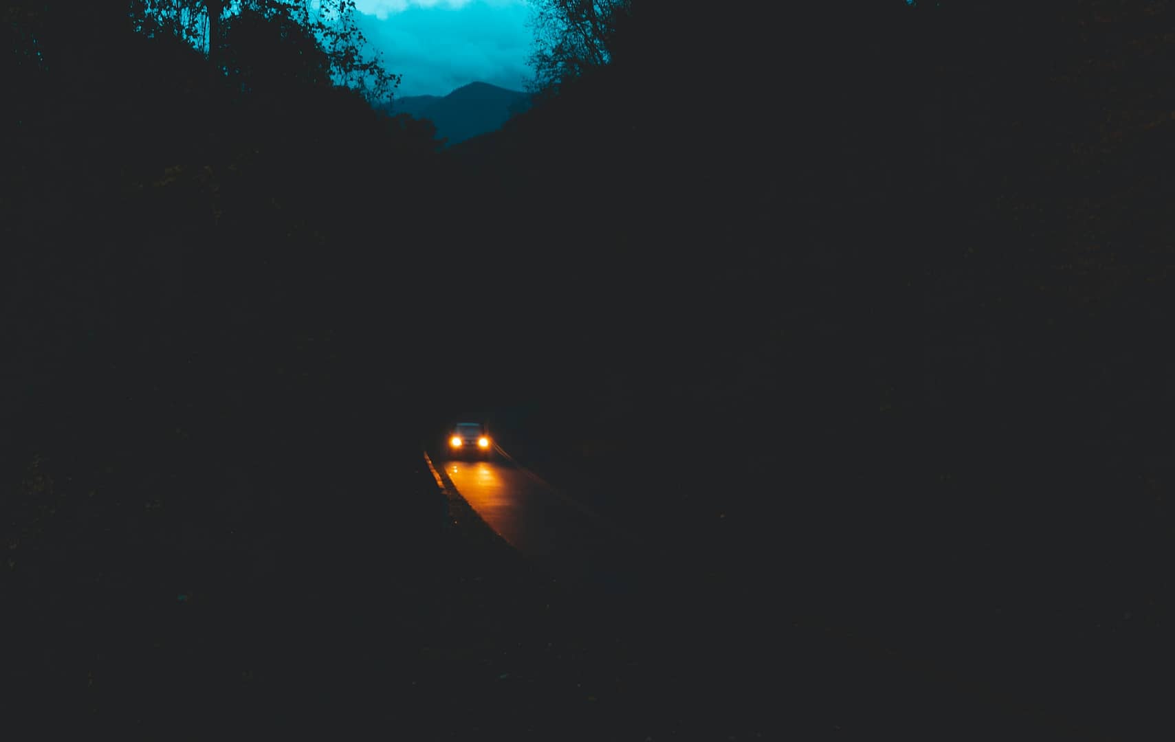A car on a dark road