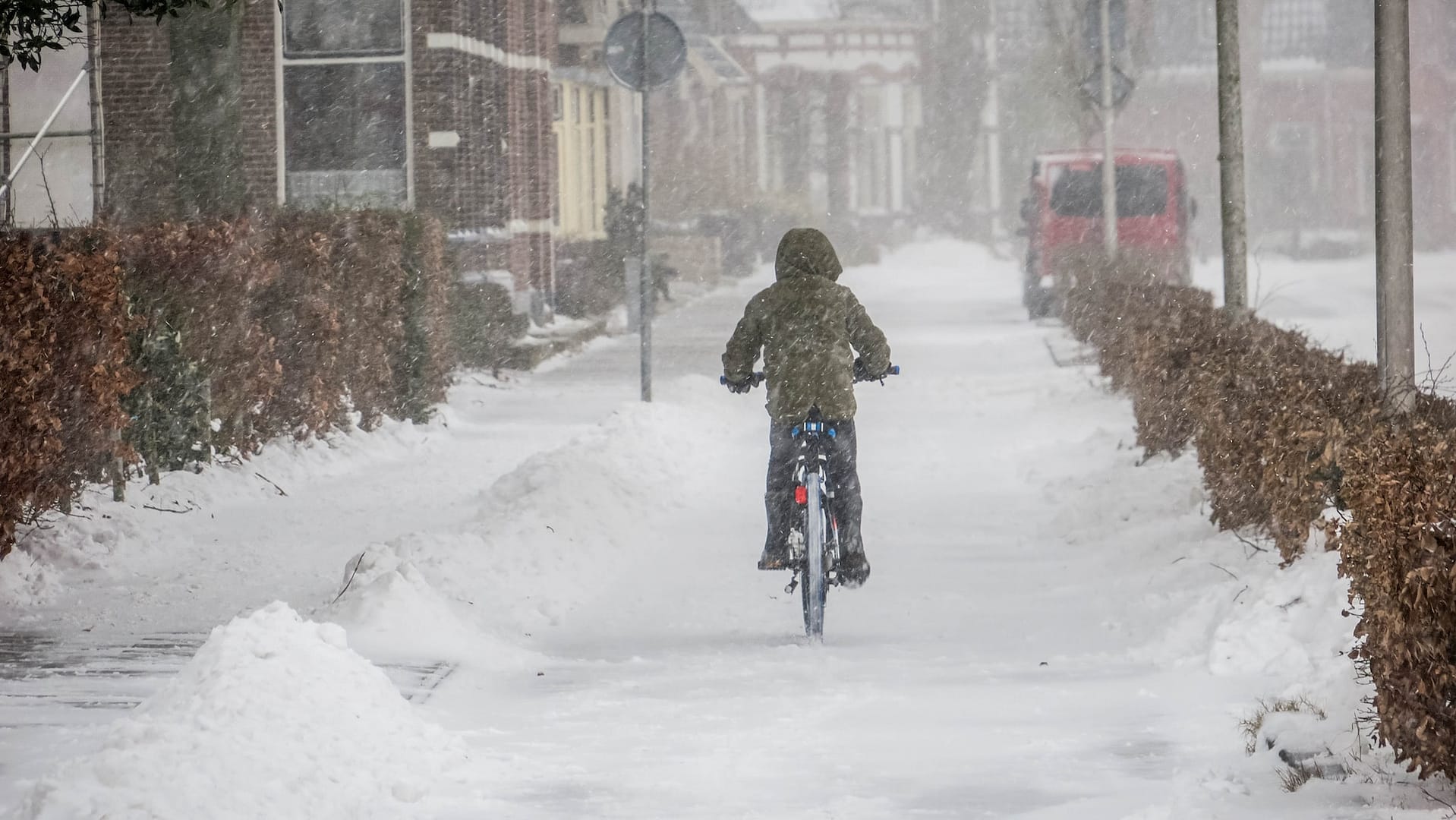 someone cycling in snow