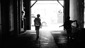 two school children walking