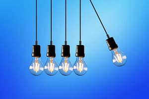 A set of five hanging lightbulbs against a dark blue background
