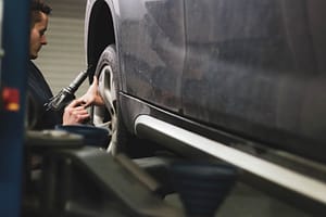 A mechanic inspecting a tyre