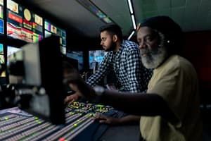 two people analysing screens