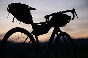 A helmet resting on the back of a bicycle