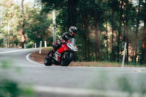 Someone riding a bike on a country road