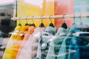 A row of coats in a shop window