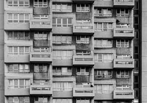 A black and white image of a block of high rise flats