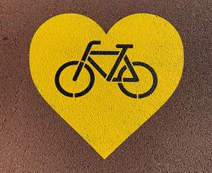 a bicycle in a yellow hear spray painted on a road