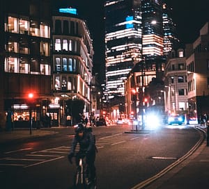 Cycling at night on a busy road