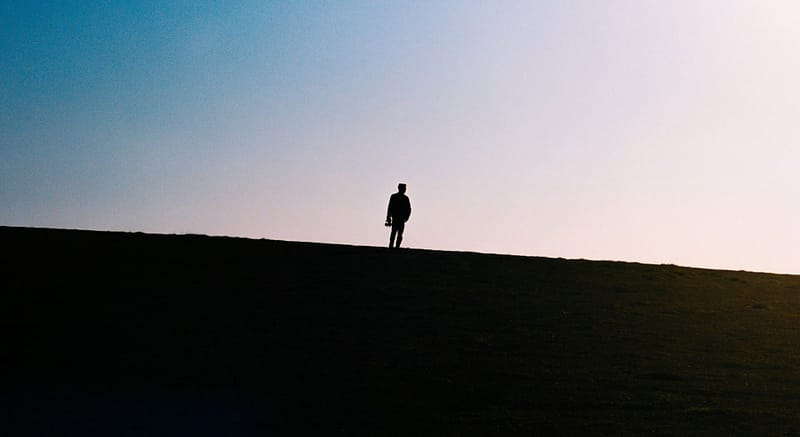 Someone standing alone outside