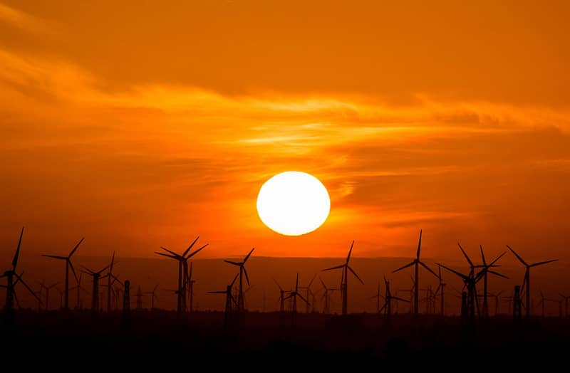 sunset over wind turbines