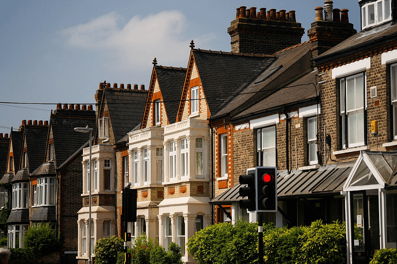 row of houses next to a busy street