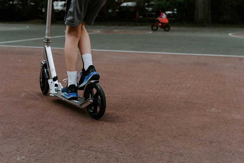 child on a scooter