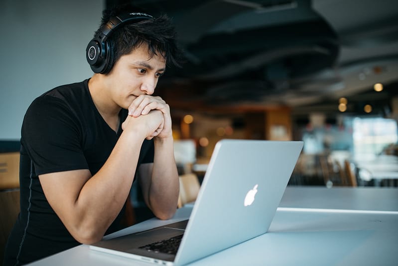 man sat at his laptop