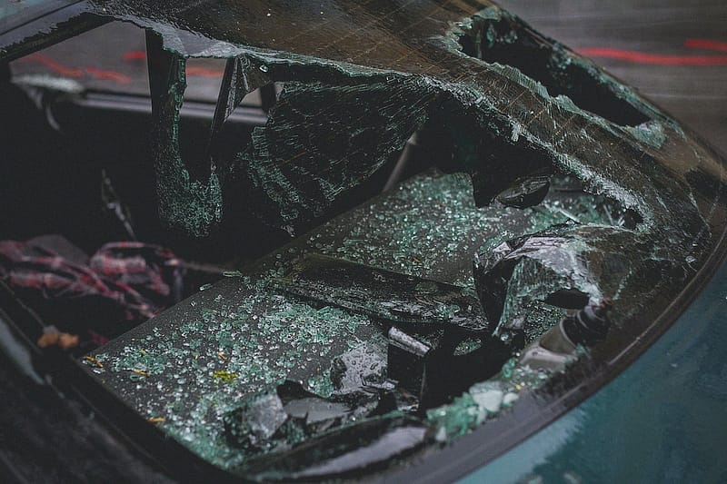 A broken windshield of a car