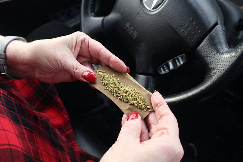 Rolling a joint inside the car