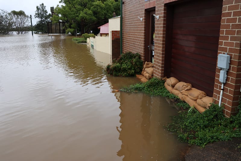 Sandbags protecting house from flooding