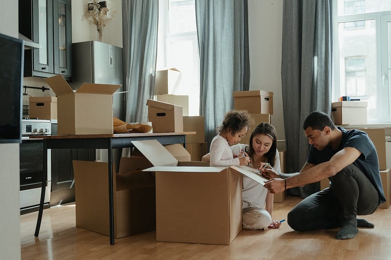 A family packing boxes