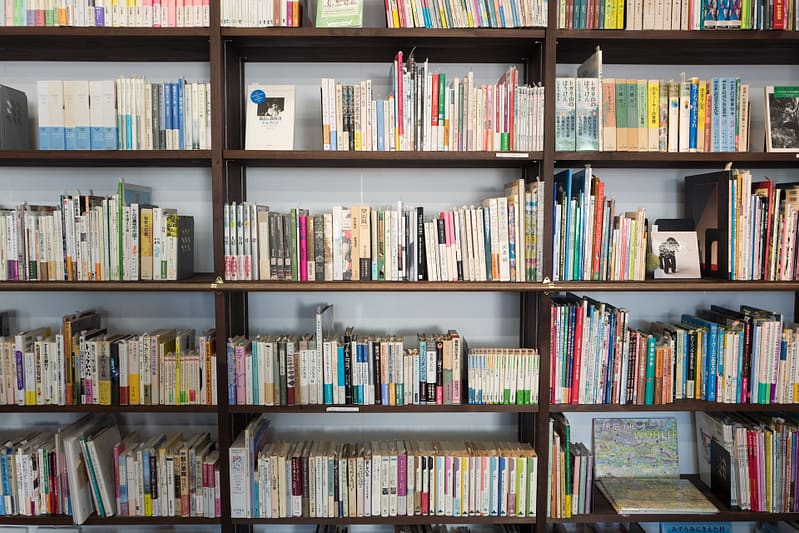 a library wall full of books on shelves