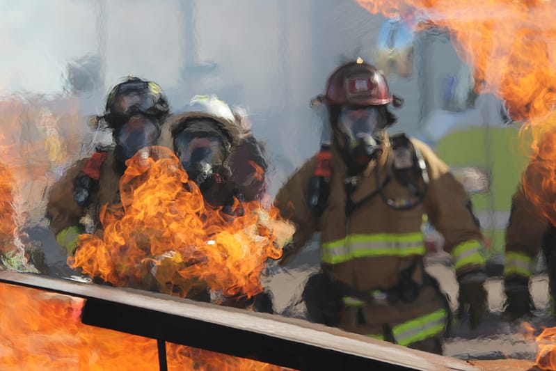 Firefighters dealing with an open fire